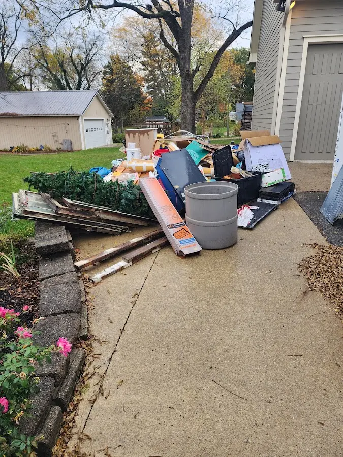 Dumpster being loaded with debris for Residential Dumpster Rental in Jarrell